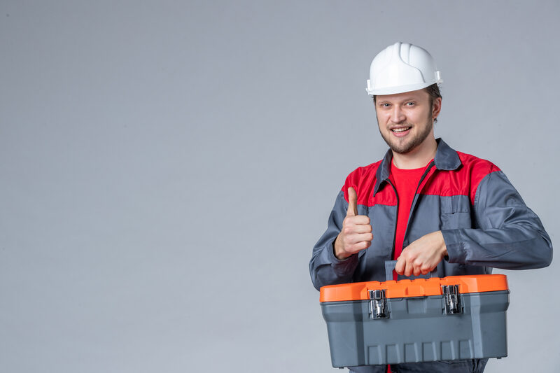 Friendly licensed HVAC technician with toolbox